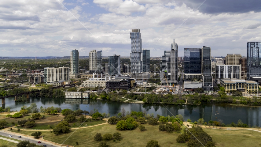 Tall city skyscrapers across Lady Bird Lake, Downtown Austin, Texas Aerial Stock Photo DXP002_102_0014 | Axiom Images