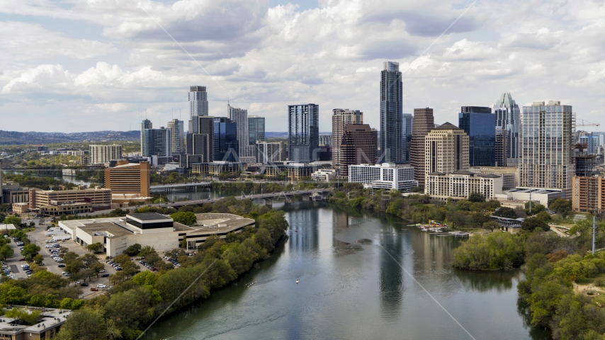 Skyscrapers in the city skyline seen from Lady Bird Lake, Downtown Austin, Texas Aerial Stock Photo DXP002_102_0018 | Axiom Images