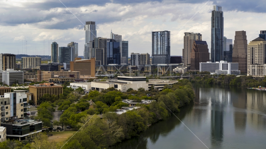 A view of waterfront skyscrapers by Lady Bird Lake in Downtown Austin, Texas Aerial Stock Photo DXP002_103_0009 | Axiom Images