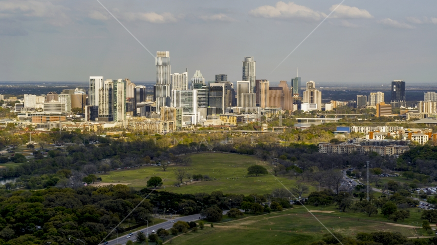 A wide view of city skyline by Lady Bird Lake, Downtown Austin, Texas Aerial Stock Photo DXP002_104_0007 | Axiom Images