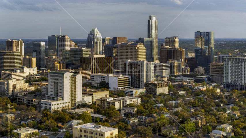 A courthouse, office buildings, and skyscrapers at sunset in Downtown Austin, Texas Aerial Stock Photo DXP002_104_0016 | Axiom Images