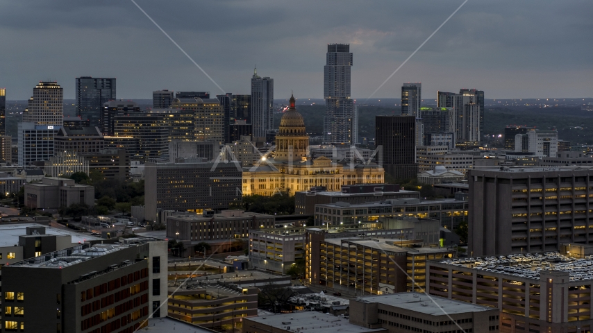 A view of office buildings, capitol and skyscrapers at twilight in Downtown Austin, Texas Aerial Stock Photo DXP002_105_0020 | Axiom Images