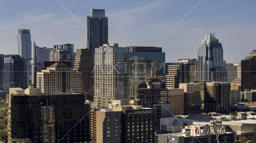 The Austonian skyscraper by a high-rise hotel in Downtown Austin, Texas Aerial Stock Photo DXP002_108_0009 | Axiom Images