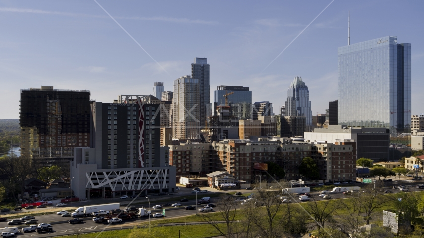 A view of tall city skyscrapers and high-rise hotel in Downtown Austin, Texas Aerial Stock Photo DXP002_108_0012 | Axiom Images