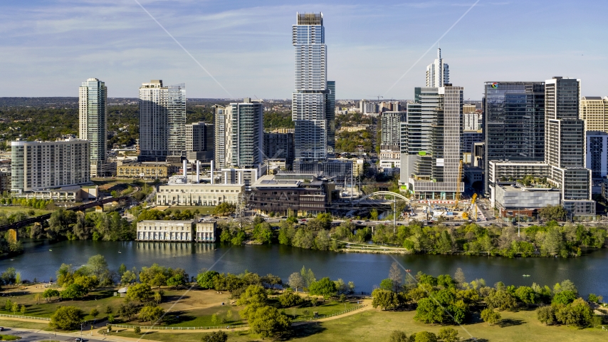 A modern skyscraper on the opposite side of Lady Bird Lake, Downtown Austin, Texas Aerial Stock Photo DXP002_109_0009 | Axiom Images