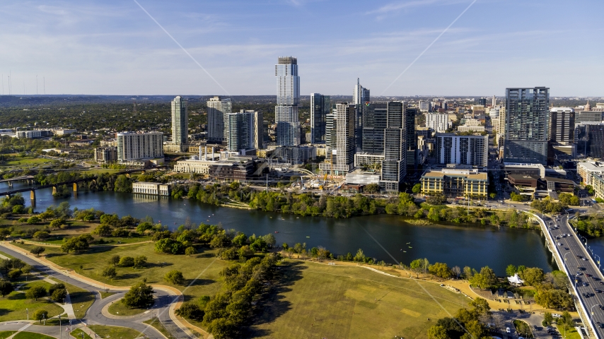 Skyscrapers in the city's waterfront skyline on the other side of Lady Bird Lake, Downtown Austin, Texas Aerial Stock Photo DXP002_109_0014 | Axiom Images