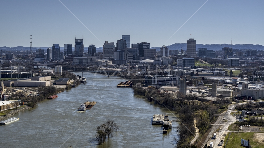 A barge on the river and the city's skyline, Downtown Nashville, Tennessee Aerial Stock Photo DXP002_112_0007 | Axiom Images