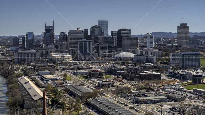 The city's riverfront skyline, seen from the side of the river, Downtown Nashville, Tennessee Aerial Stock Photo DXP002_113_0001 | Axiom Images