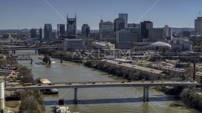 Skyscrapers in the city's skyline, seen from a bridge over the river, Downtown Nashville, Tennessee Aerial Stock Photo DXP002_113_0003 | Axiom Images