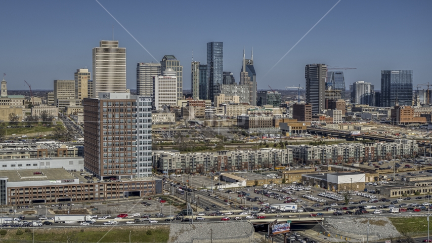 The city's skyline seen from office building and apartment complexes in Downtown Nashville, Tennessee Aerial Stock Photo DXP002_113_0004 | Axiom Images