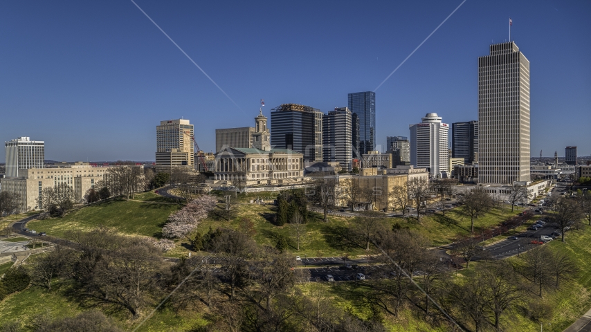 The Tennessee State Capitol near tall skyscrapers in Downtown Nashville, Tennessee Aerial Stock Photo DXP002_114_0005 | Axiom Images