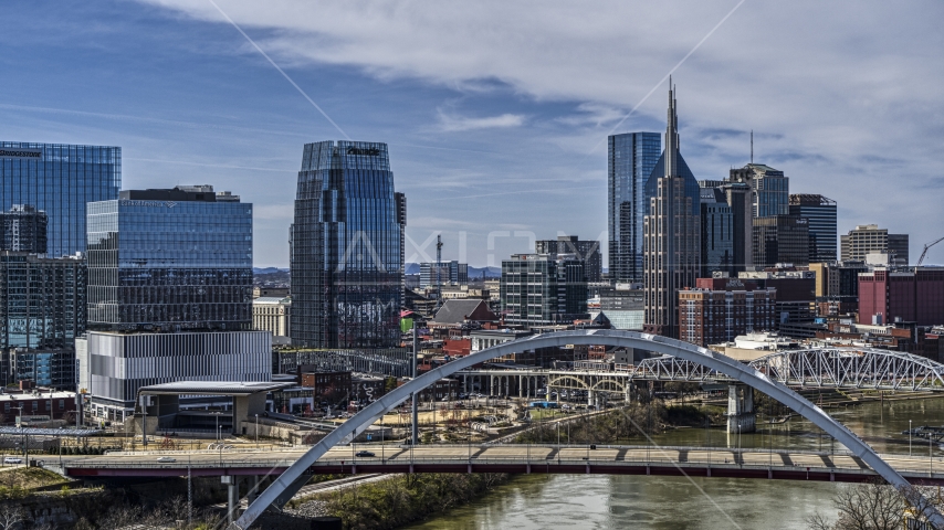 A view the AT&T Building seen from a bridge and the river in Downtown Nashville, Tennessee Aerial Stock Photo DXP002_116_0013 | Axiom Images