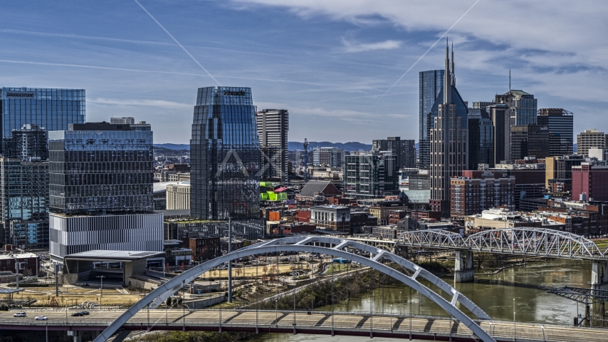 A view of the AT&T Building seen from near a bridge spanning the river in Downtown Nashville, Tennessee Aerial Stock Photo DXP002_116_0014 | Axiom Images