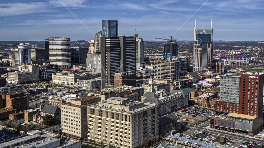 A high-rise hotel and skyscrapers in Downtown Nashville, Tennessee Aerial Stock Photo DXP002_118_0002 | Axiom Images