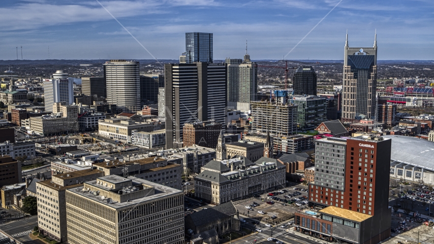 A high-rise hotel by skyscrapers in Downtown Nashville, Tennessee Aerial Stock Photo DXP002_118_0005 | Axiom Images