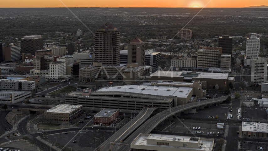 Office high-rises and convention center near office tower and shorter hotel tower at sunset, Downtown Albuquerque, New Mexico Aerial Stock Photo DXP002_122_0010 | Axiom Images