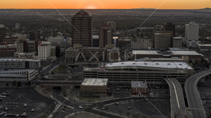 Office tower and shorter hotel tower behind convention center at sunset, Downtown Albuquerque, New Mexico Aerial Stock Photo DXP002_122_0011 | Axiom Images