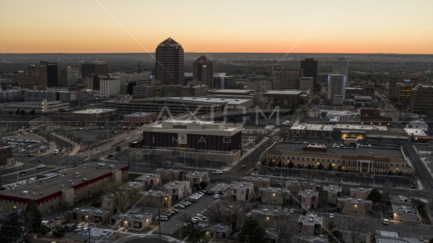 Office tower and hotel tower at sunset near office high-rises, Downtown Albuquerque, New Mexico Aerial Stock Photo DXP002_123_0002 | Axiom Images