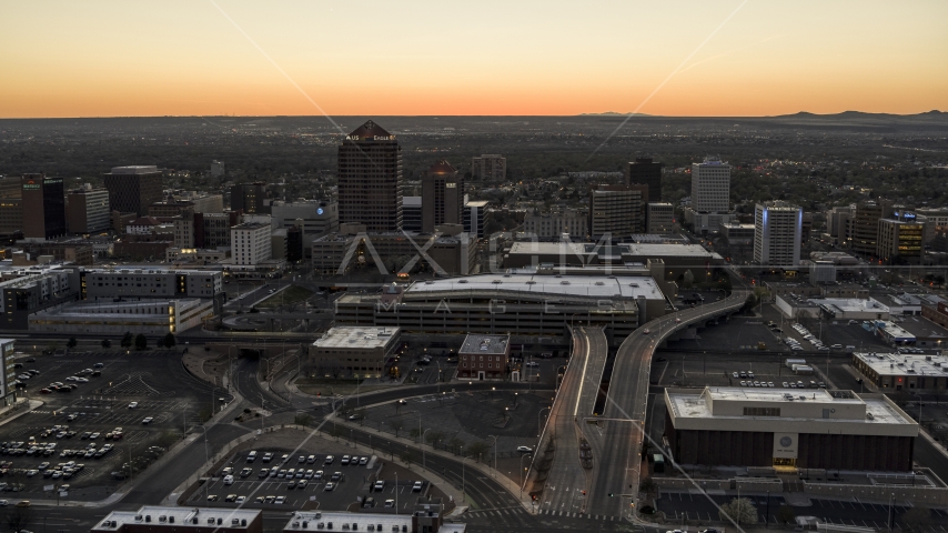 Albuquerque Plaza and Hyatt Regency at sunset near office high-rises, Downtown Albuquerque, New Mexico Aerial Stock Photo DXP002_123_0003 | Axiom Images