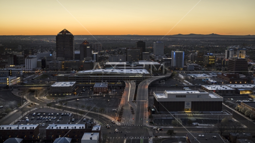 A view of Albuquerque Plaza, Hyatt Regency and city high-rises at sunset, Downtown Albuquerque, New Mexico Aerial Stock Photo DXP002_123_0005 | Axiom Images