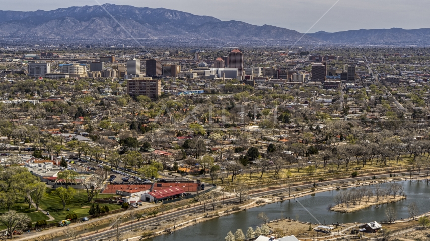 High-rise office buildings seen from Tingley Beach, Downtown Albuquerque, New Mexico Aerial Stock Photo DXP002_124_0001 | Axiom Images