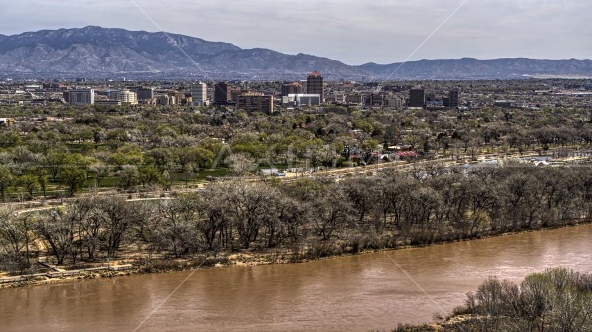 High-rise office buildings seen from the Rio Grande, Downtown Albuquerque, New Mexico Aerial Stock Photo DXP002_124_0002 | Axiom Images