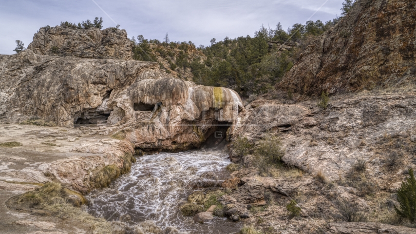 A view of rapids flowing through a rock formation in the mountains of New Mexico Aerial Stock Photo DXP002_129_0002 | Axiom Images