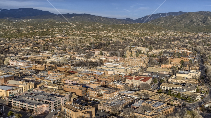 A view across downtown buildings in Santa Fe, New Mexico Aerial Stock Photo DXP002_132_0001 | Axiom Images