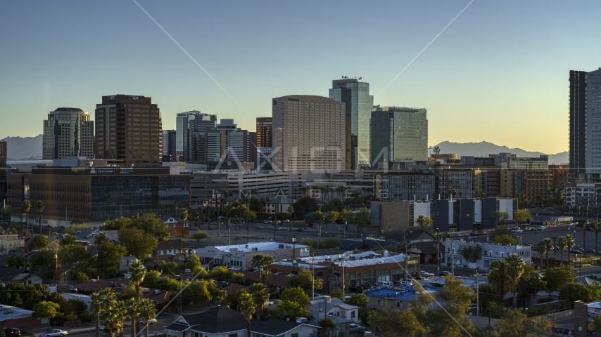 A hotel and high-rise office buildings at sunset in Downtown Phoenix, Arizona Aerial Stock Photo DXP002_138_0011 | Axiom Images