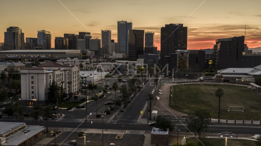 Tall office high-rises at sunset in Downtown Phoenix, Arizona Aerial Stock Photo DXP002_139_0001 | Axiom Images