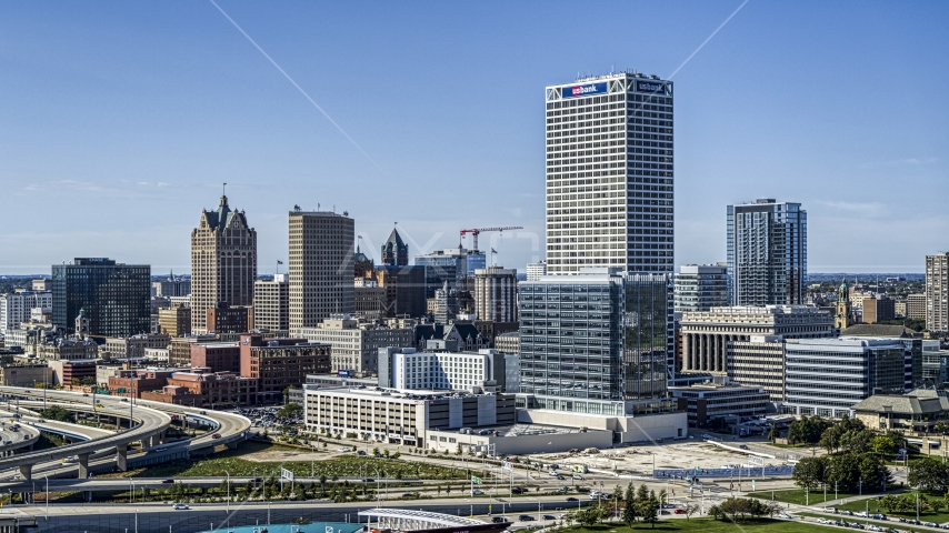 Tall city buildings and a skyscraper in Downtown Milwaukee, Wisconsin Aerial Stock Photo DXP002_149_0002 | Axiom Images