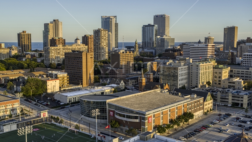 The skyline seen from college campus at sunset in Downtown Milwaukee, Wisconsin Aerial Stock Photo DXP002_150_0001 | Axiom Images