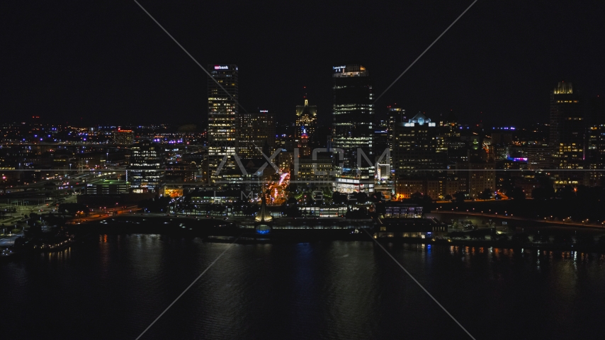 A pair of towering skyscrapers seen from the lake at night, Downtown Milwaukee, Wisconsin Aerial Stock Photo DXP002_157_0007 | Axiom Images