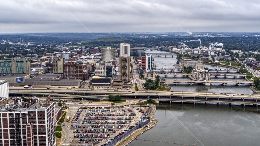 Wide view of apartment high-rise and office buildings near bridges and river, Downtown Cedar Rapids, Iowa Aerial Stock Photo DXP002_164_0003 | Axiom Images