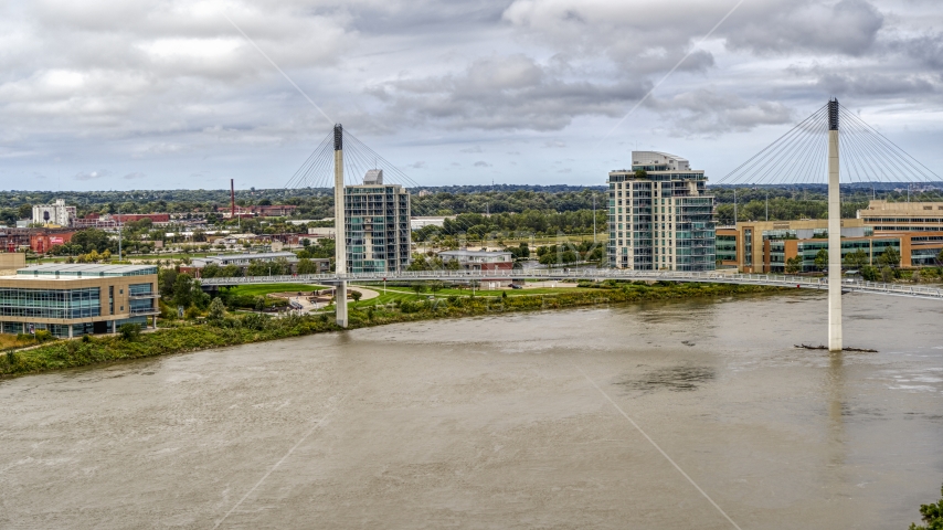 A view of a pedestrian bridge spanning the Missouri River, Omaha, Nebraska Aerial Stock Photo DXP002_168_0005 | Axiom Images