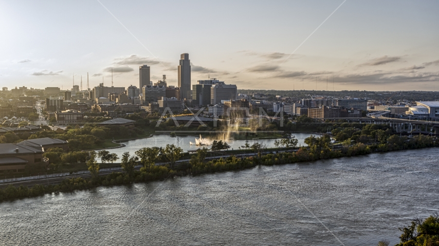 A fountain with view of skyline at sunset, Downtown Omaha, Nebraska Aerial Stock Photo DXP002_172_0005 | Axiom Images