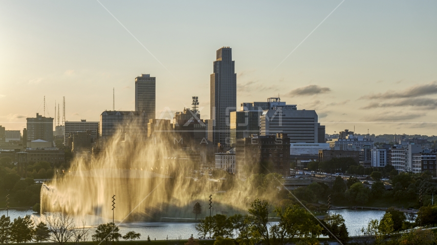 A skyscraper seen from fountain at sunset, Downtown Omaha, Nebraska Aerial Stock Photo DXP002_172_0007 | Axiom Images