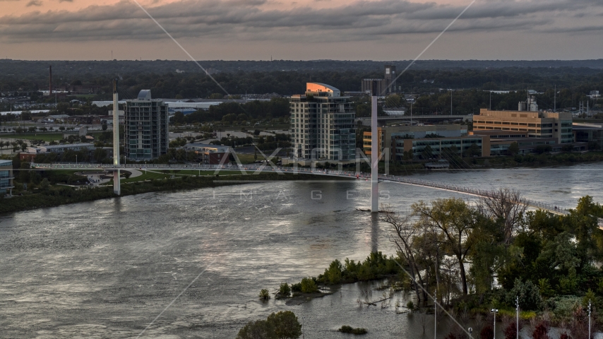 A pedestrian bridge spanning the Missouri River at sunset, Omaha, Nebraska Aerial Stock Photo DXP002_172_0012 | Axiom Images