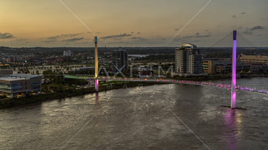 A pedestrian bridge over the Missouri River at twilight, Omaha, Nebraska Aerial Stock Photo DXP002_172_0018 | Axiom Images