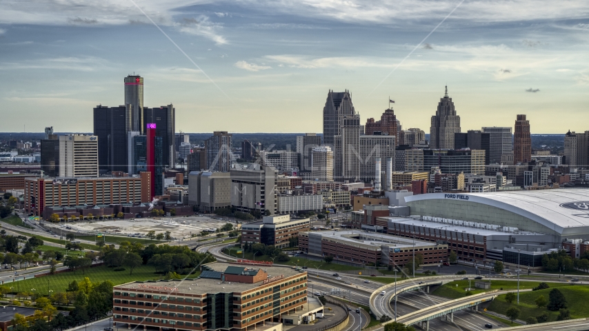 The skyline seen from near football stadium at sunset in Downtown Detroit, Michigan Aerial Stock Photo DXP002_191_0006 | Axiom Images