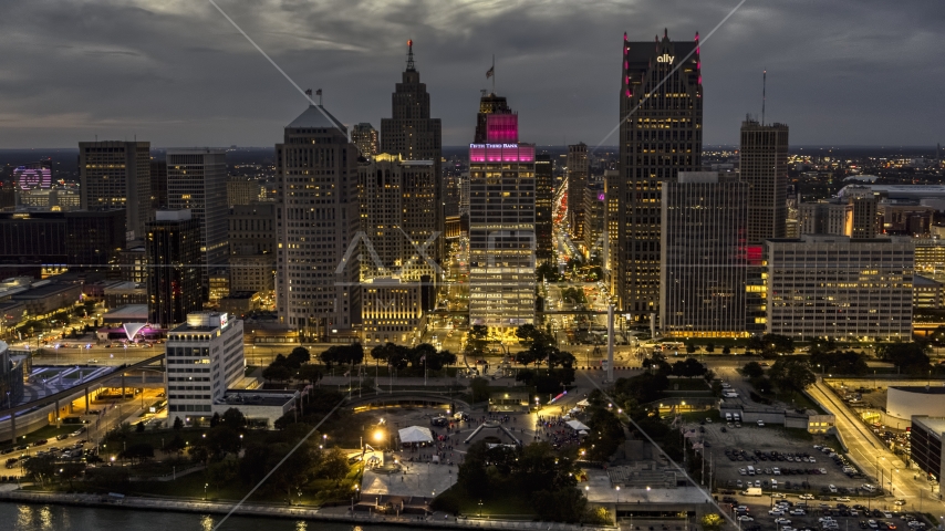 A view of tall downtown skyscrapers at twilight seen from the river, Downtown Detroit, Michigan Aerial Stock Photo DXP002_193_0003 | Axiom Images