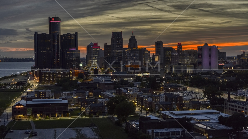 Tall skyscrapers at twilight in Downtown Detroit, Michigan Aerial Stock Photo DXP002_198_0002 | Axiom Images