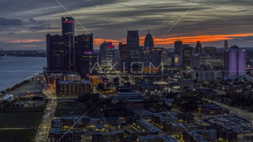 Giant skyscrapers at twilight in Downtown Detroit, Michigan Aerial Stock Photo DXP002_198_0003 | Axiom Images