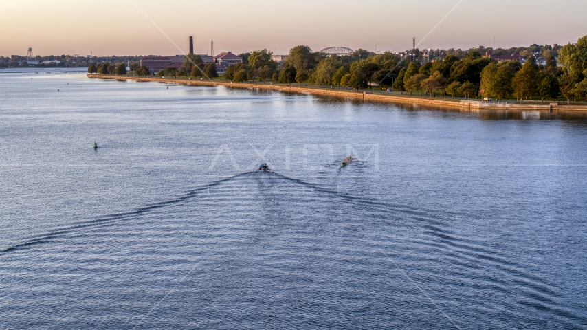 A rowboat and speedboat on Lake Erie at sunset, Buffalo, New York Aerial Stock Photo DXP002_204_0004 | Axiom Images