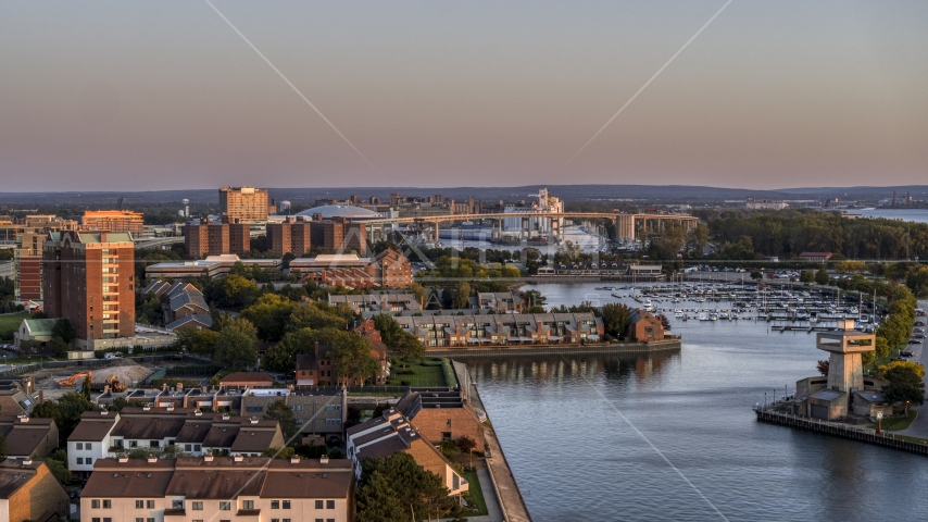 The Buffalo Skyway behind marina at sunset, Downtown Buffalo, New York Aerial Stock Photo DXP002_204_0014 | Axiom Images