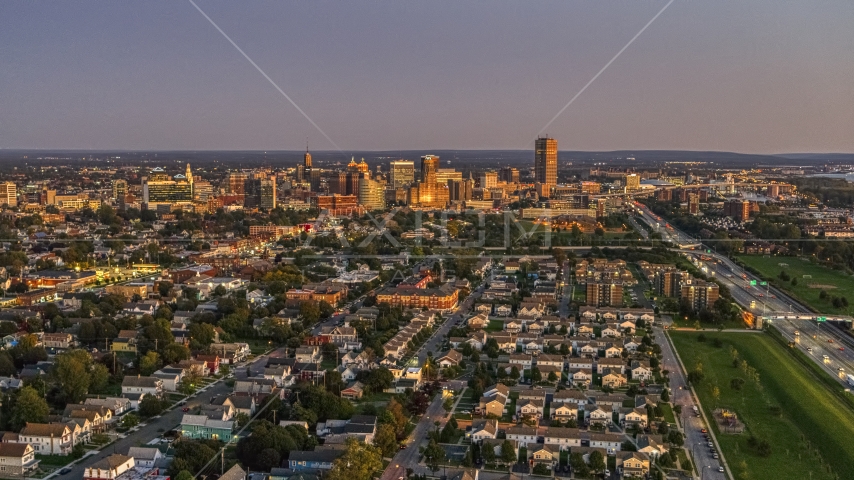 Seneca One Tower and the city's skyline seen from I-190 at twilight, Downtown Buffalo, New York Aerial Stock Photo DXP002_204_0017 | Axiom Images