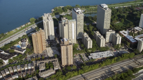 AX0001_012.0000407F - Aerial stock photo of A group of lakefront apartment buildings in Hyde Park, Chicago, Illinois