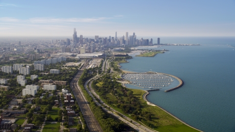 AX0001_014.0000123F - Aerial stock photo of The Downtown Chicago skyline and Lake Michigan, on a hazy day, Illinois