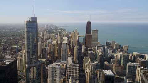 AX0001_028.0000086F - Aerial stock photo of Trump International and John Hancock Center in Downtown Chicago, Illinois, on a hazy day