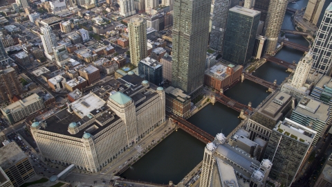 AX0001_046.0000223F - Aerial stock photo of The Merchandise Mart beside the Chicago River, Downtown Chicago, Illinois